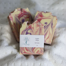 Load image into Gallery viewer, Marbled soap bars with a 'Divinity' label on a textured surface
