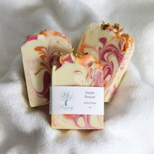 Load image into Gallery viewer, Marbled soap bar with a visible brand label on a soft white background