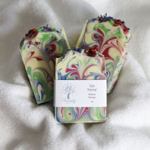 Load image into Gallery viewer, Colorful marbled soap with a label on a white fabric background