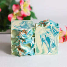 Load image into Gallery viewer, Two marbled soap bars with green and blue swirls on a light background.
